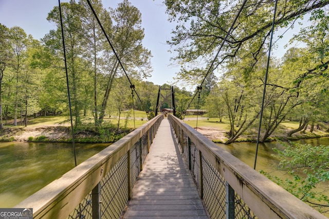 surrounding community with a water view