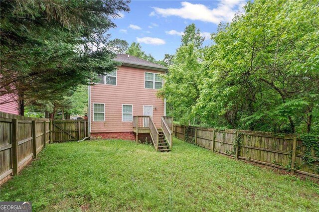 2171 Wilson Ave NW, Atlanta, GA 30314 - rear view of property with a yard and a fenced backyard