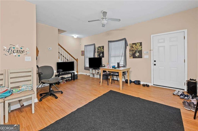 2171 Wilson Ave NW, Atlanta, GA 30314 - living room featuring baseboards, stairs, ceiling fan, and wood finished floors