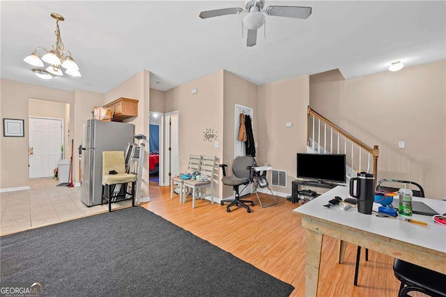 2171 Wilson Ave NW, Atlanta, GA 30314 - office space featuring light wood-style flooring, ceiling fan with notable chandelier, baseboards, and visible vents