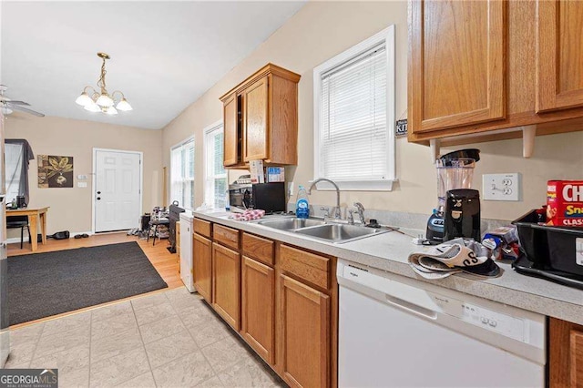 2171 Wilson Ave NW, Atlanta, GA 30314 - kitchen with a sink, brown cabinets, decorative light fixtures, dishwasher, and light countertops