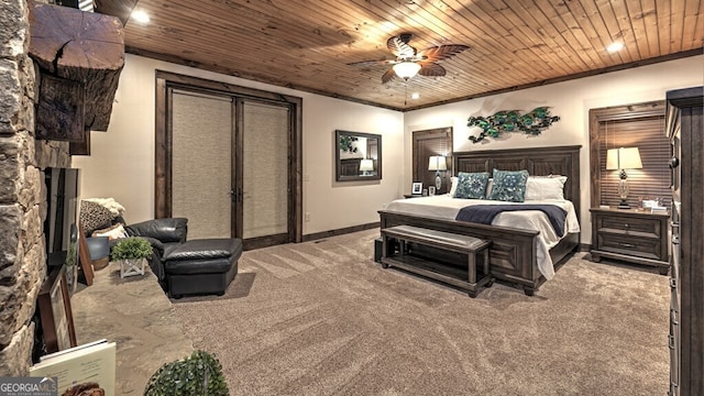 bedroom featuring a stone fireplace, ceiling fan, wooden ceiling, and carpet