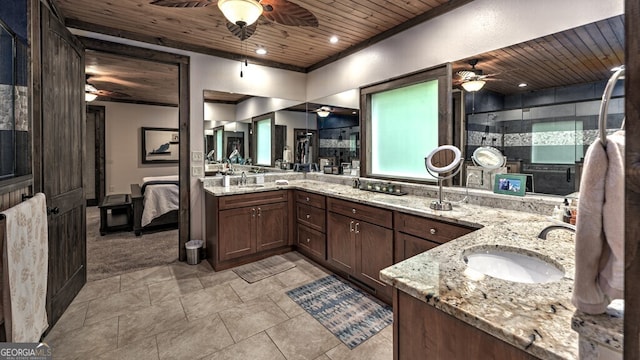 bathroom with double vanity, wood ceiling, a ceiling fan, and a sink