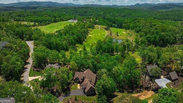 bird's eye view featuring a water and mountain view and a forest view