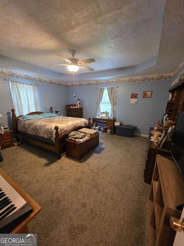 1180 Edwards Mill Rd, Ball Ground, GA 30107 - carpeted bedroom featuring a textured ceiling and a ceiling fan