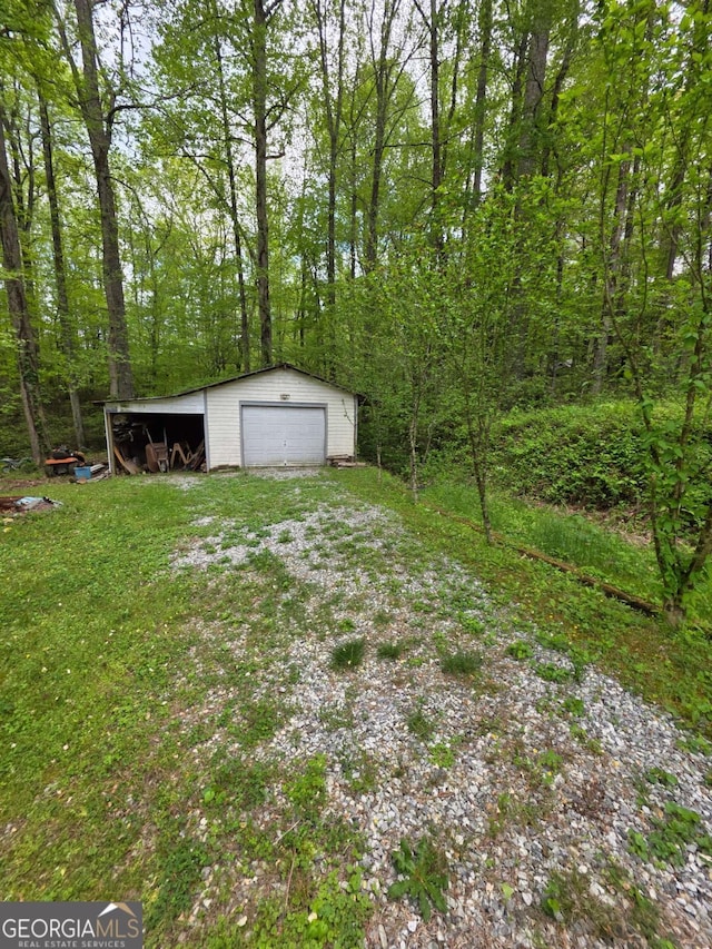 1180 Edwards Mill Rd, Ball Ground, GA 30107 - view of yard featuring an outdoor structure and a garage