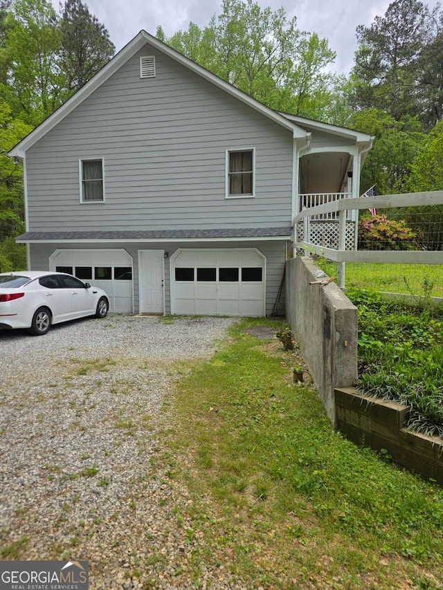 1180 Edwards Mill Rd, Ball Ground, GA 30107 - view of home's exterior featuring an attached garage and driveway