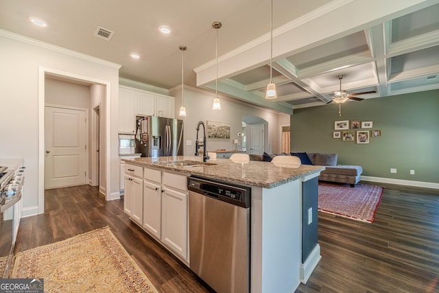 116 Blue Billed Xing, Jefferson, GA 30549 - kitchen with stainless steel appliances, arched walkways, dark wood finished floors, a ceiling fan, and light stone counters
