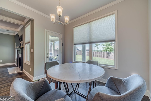 116 Blue Billed Xing, Jefferson, GA 30549 - dining room with crown molding, dark wood-style floors, a chandelier, and a fireplace with flush hearth