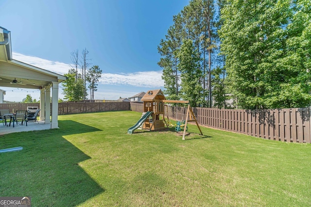 116 Blue Billed Xing, Jefferson, GA 30549 - fenced backyard featuring ceiling fan, a patio area, and a playground