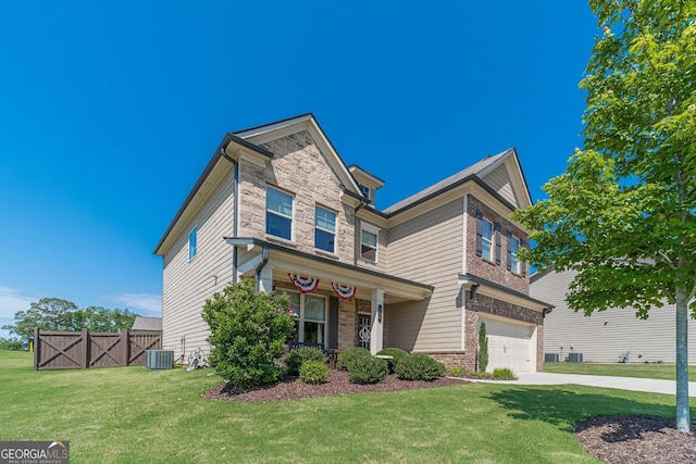 116 Blue Billed Xing, Jefferson, GA 30549 - view of front facade featuring stone siding, a garage, a porch, and driveway