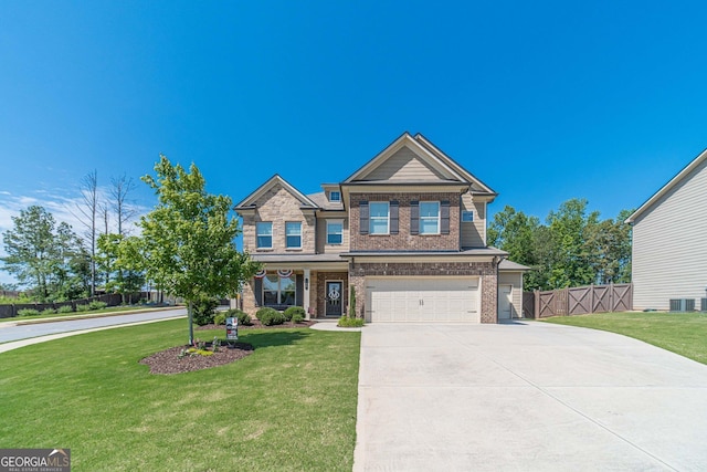 116 Blue Billed Xing, Jefferson, GA 30549 - craftsman-style home with brick siding, a garage, and driveway