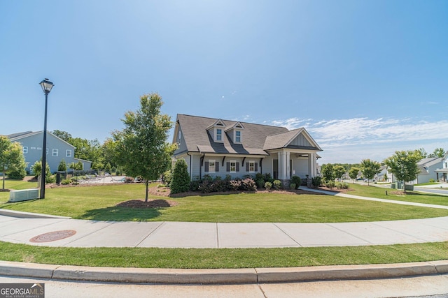 116 Blue Billed Xing, Jefferson, GA 30549 - view of front facade featuring a front lawn and a garage