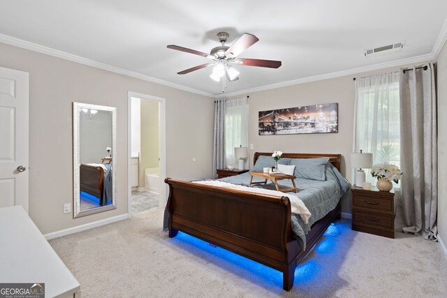 carpeted bedroom with a ceiling fan, baseboards, visible vents, connected bathroom, and crown molding