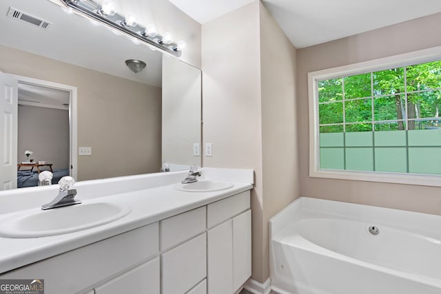 4355 Saddlewood Ct, Gillsville, GA 30543 - bathroom featuring double vanity, a garden tub, and connected bathroom