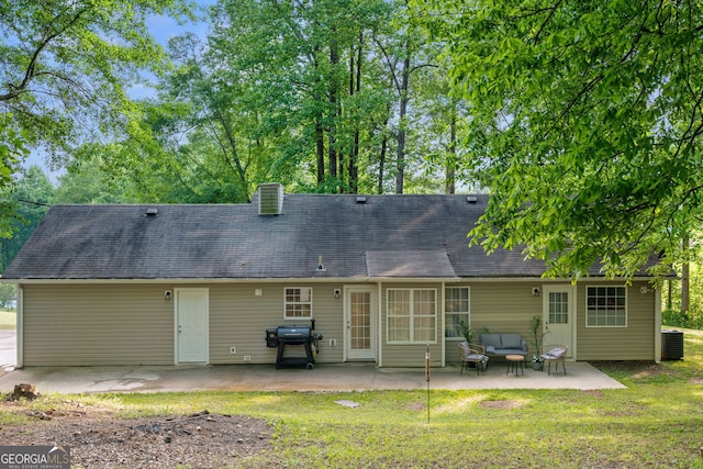 4355 Saddlewood Ct, Gillsville, GA 30543 - back of property featuring a patio, outdoor lounge area, a lawn, and a shingled roof