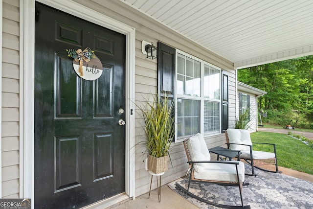 property entrance featuring a porch