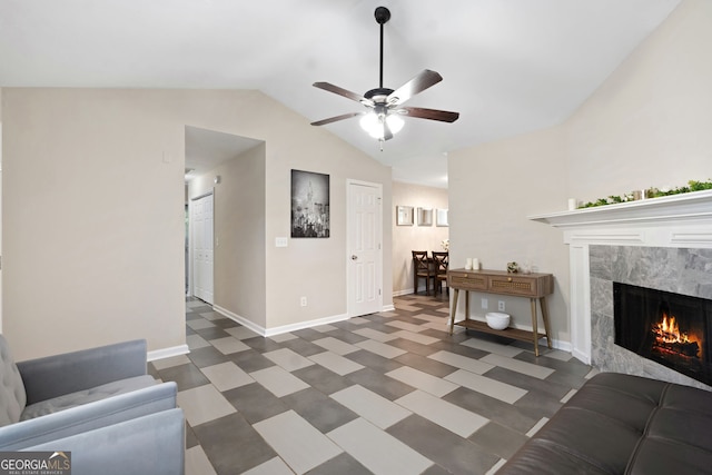 4355 Saddlewood Ct, Gillsville, GA 30543 - living room with vaulted ceiling, a ceiling fan, tile patterned floors, and a premium fireplace
