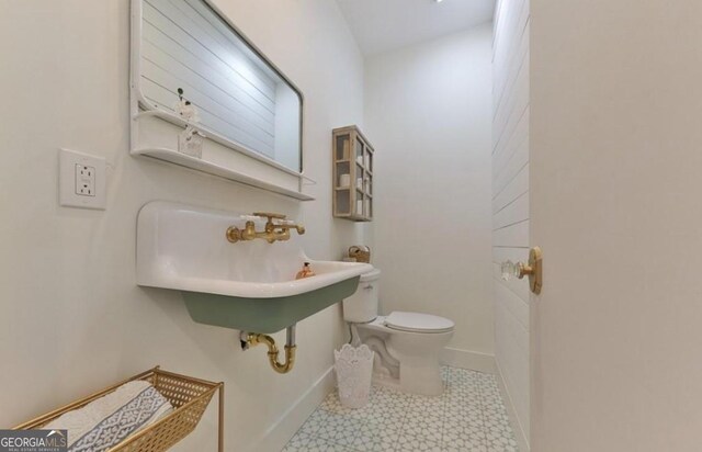 185 A W Roberts Dr, Ball Ground, GA 30107 - half bath with toilet, tile patterned floors, and baseboards