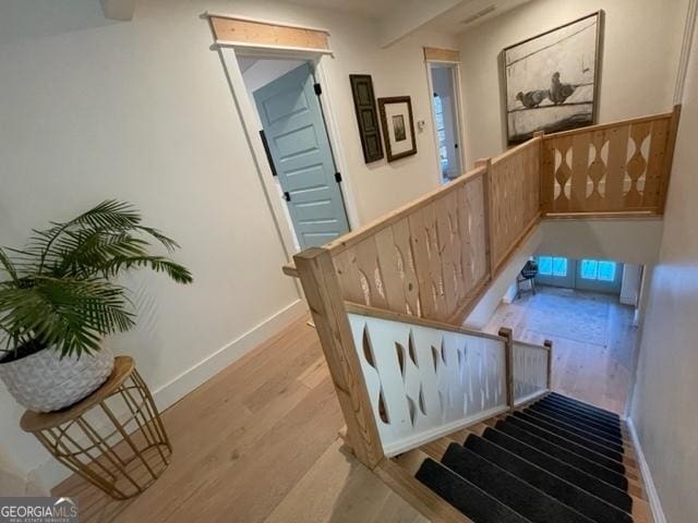 185 A W Roberts Dr, Ball Ground, GA 30107 - stairway featuring wood finished floors and baseboards