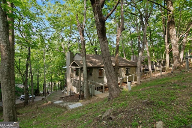 200 Villa Rd Unit 128, Jasper, GA 30143 - back of property with a chimney and an attached garage