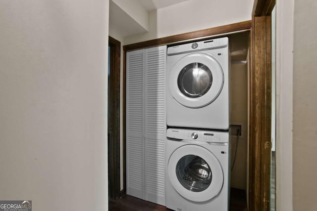 laundry area with laundry area and stacked washer and dryer