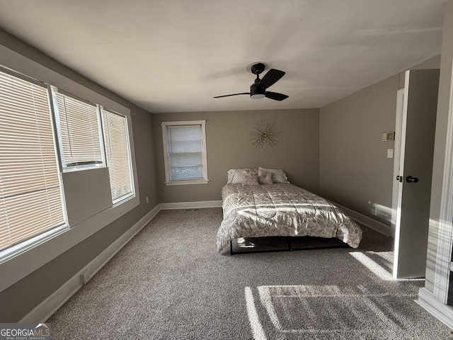 1057 Clay Ave, Macon, GA 31211 - carpeted bedroom with baseboards and a ceiling fan