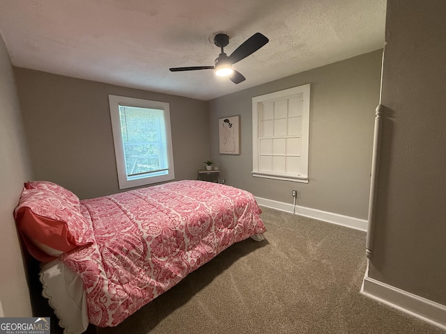 1057 Clay Ave, Macon, GA 31211 - carpeted bedroom featuring baseboards and a ceiling fan