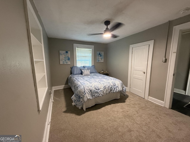 1057 Clay Ave, Macon, GA 31211 - bedroom featuring baseboards, ceiling fan, and carpet