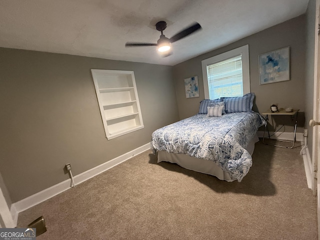 1057 Clay Ave, Macon, GA 31211 - carpeted bedroom with baseboards and a ceiling fan