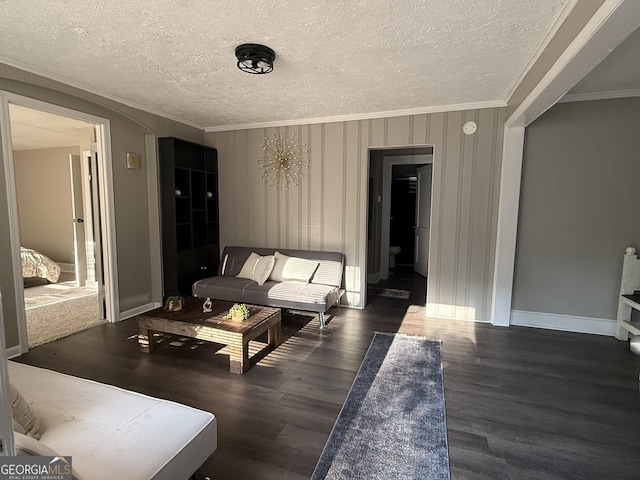 1057 Clay Ave, Macon, GA 31211 - living area featuring ornamental molding, wood finished floors, and a textured ceiling