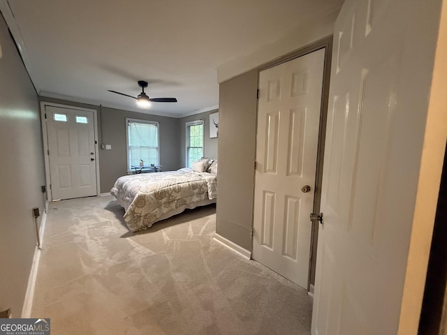 1057 Clay Ave, Macon, GA 31211 - bedroom featuring crown molding, ceiling fan, carpet flooring, and baseboards