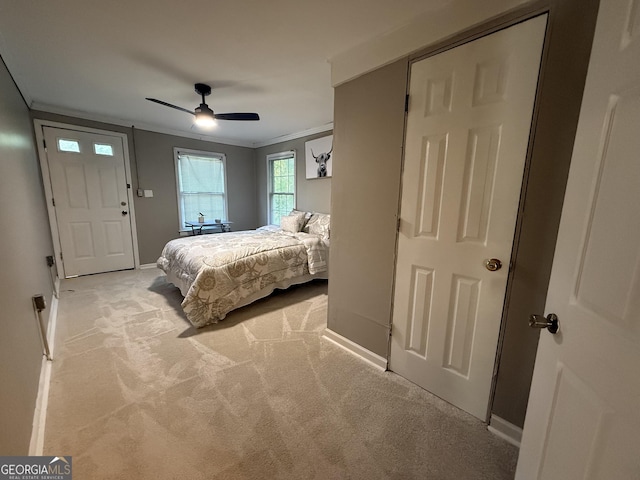 1057 Clay Ave, Macon, GA 31211 - bedroom featuring light colored carpet, baseboards, a ceiling fan, and ornamental molding