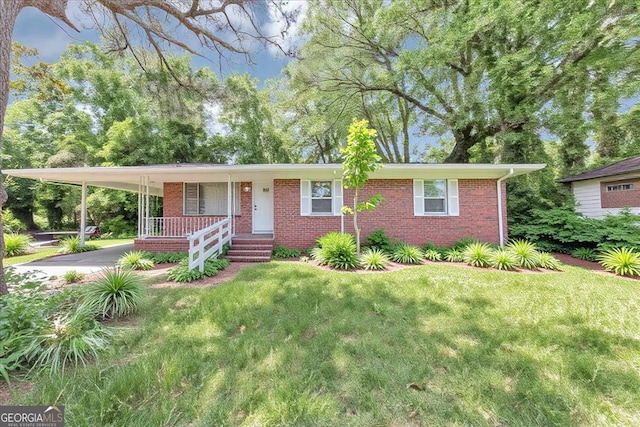 844 Oak St NW, Atlanta, GA 30318 - ranch-style house with covered porch, brick siding, driveway, a carport, and a front lawn