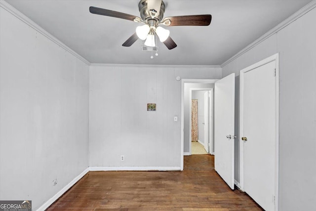 844 Oak St NW, Atlanta, GA 30318 - unfurnished bedroom featuring baseboards, ornamental molding, ceiling fan, and wood finished floors