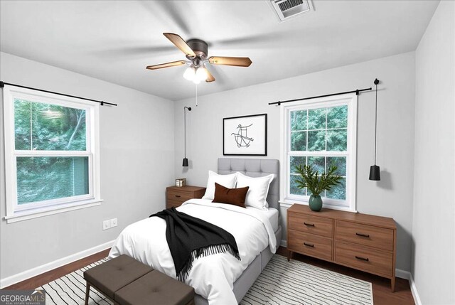 844 Oak St NW, Atlanta, GA 30318 - bedroom featuring baseboards, a ceiling fan, visible vents, and wood finished floors