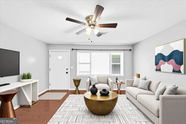 844 Oak St NW, Atlanta, GA 30318 - living area featuring baseboards, a ceiling fan, visible vents, and wood finished floors