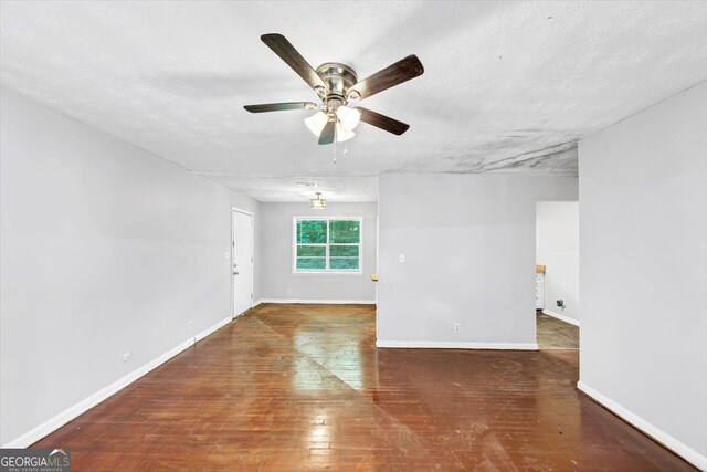844 Oak St NW, Atlanta, GA 30318 - unfurnished room with a textured ceiling, hardwood / wood-style floors, a ceiling fan, and baseboards