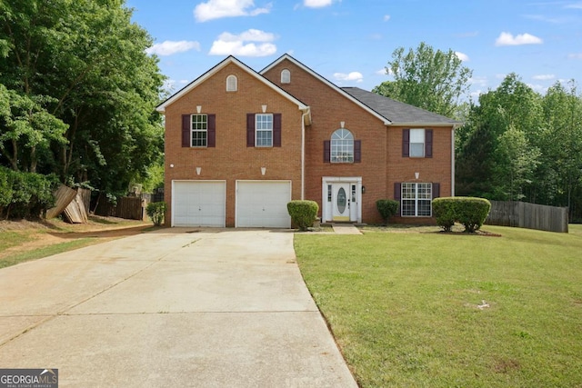 colonial house with an attached garage, driveway, fence, and a front lawn