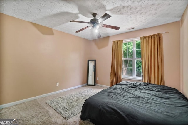1314 Durham Ter, Mcdonough, GA 30252 - bedroom featuring carpet, a textured ceiling, and a ceiling fan