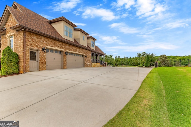 770 Tralee Dr, Fayetteville, GA 30215 - view of home's exterior with a yard, driveway, an attached garage, stucco siding, and roof with shingles