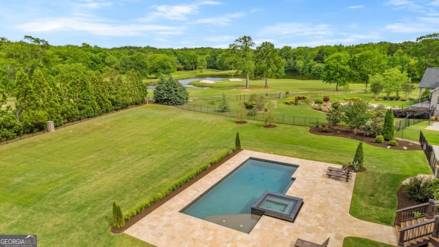 770 Tralee Dr, Fayetteville, GA 30215 - view of swimming pool featuring a water view, a pool with connected hot tub, a lawn, a fenced backyard, and a patio area