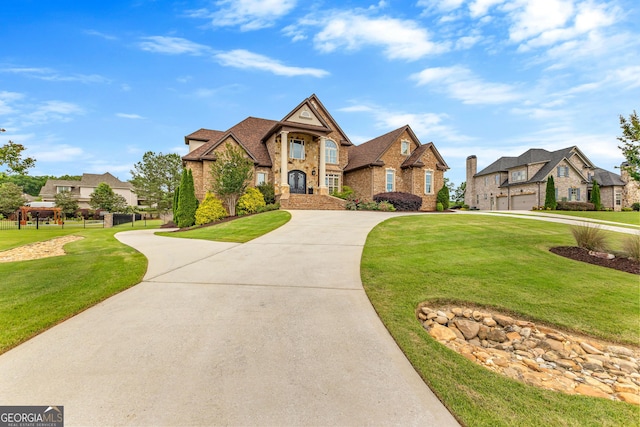 770 Tralee Dr, Fayetteville, GA 30215 - french country style house with a front lawn, a residential view, brick siding, and curved driveway
