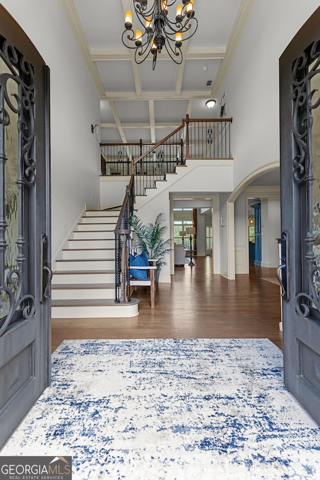 770 Tralee Dr, Fayetteville, GA 30215 - foyer featuring wood finished floors, coffered ceiling, stairway, arched walkways, and a chandelier