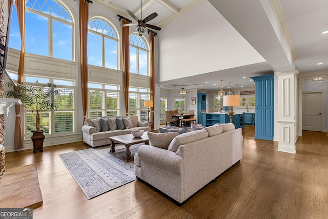 770 Tralee Dr, Fayetteville, GA 30215 - living room with a ceiling fan, decorative columns, a towering ceiling, and wood finished floors