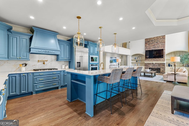 770 Tralee Dr, Fayetteville, GA 30215 - kitchen featuring crown molding, built in appliances, blue cabinetry, and custom range hood