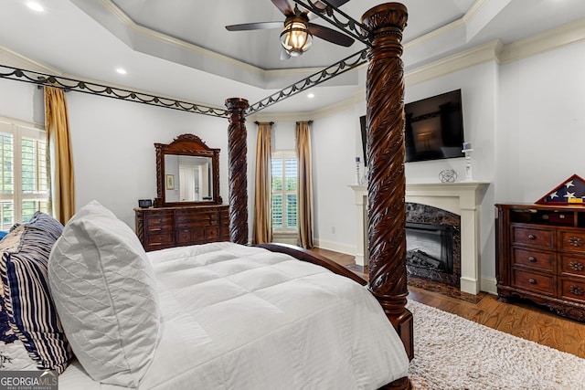 770 Tralee Dr, Fayetteville, GA 30215 - bedroom featuring a raised ceiling, ornamental molding, wood finished floors, and multiple windows