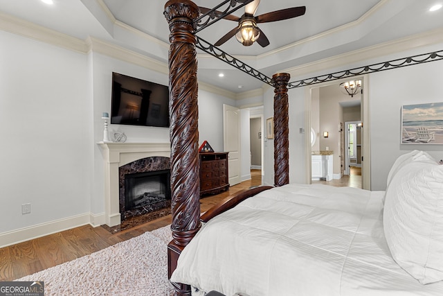 770 Tralee Dr, Fayetteville, GA 30215 - bedroom featuring a premium fireplace, recessed lighting, baseboards, crown molding, and wood finished floors