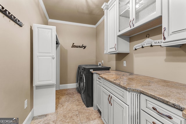 770 Tralee Dr, Fayetteville, GA 30215 - laundry area with cabinet space, washing machine and dryer, baseboards, and crown molding