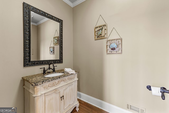 770 Tralee Dr, Fayetteville, GA 30215 - bathroom featuring vanity, ornamental molding, visible vents, and wood finished floors